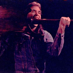 Coyote chewing his Rickenbacker